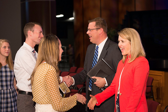 President and Sister Gilbert greet students after the first devotional of the semester.