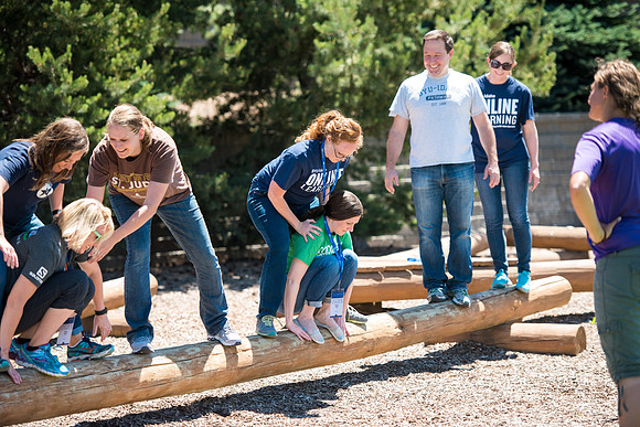 Online Instructors come to BYU-Idaho campus for further learning to enhance teaching skills. Instructors take their turn at the Ropes Course.