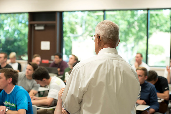 Brother Kerry Webb discusses with his class, the importance of understanding the past and future of the US economy.
