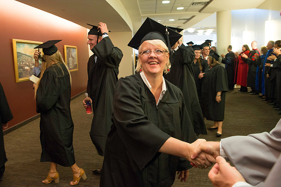 Graduates gather for BYU-Idaho commencement. Graduates march in during the processional.