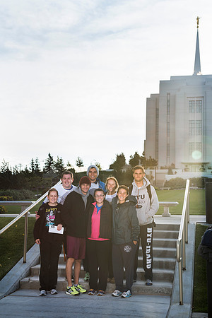 Team members pose by the Rexburg temple before they begin the temple to temple run