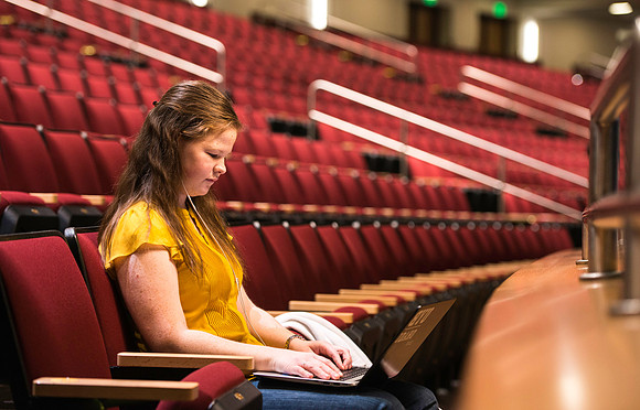 Annie Little, finds peace and quiet in the balcony of the I-Center to study for her Child Developement Online class.