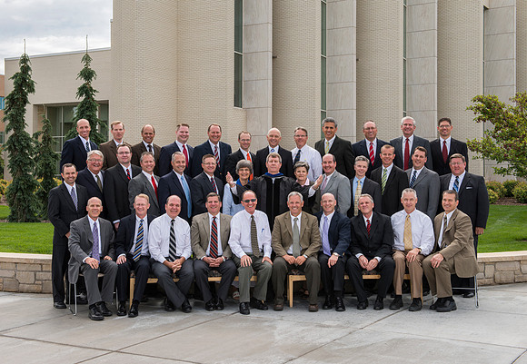 Group photo of the Religion Department in front of the Taylor Building.