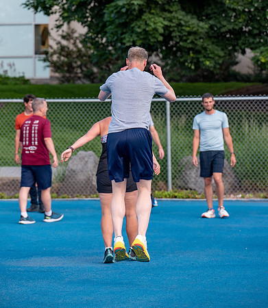 Faculty and community members of BYUI at Speed and Agility triathlete trannings at the stadium.