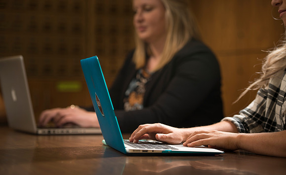 Katelyn Crompton and Rachael Redford study in the basement of the Smith Building.