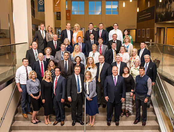 2016 President's Advancement Council. Group photo on the steps inside Legacy Hall in the Manwaring Center.