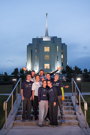 Team members pose by the Rexburg temple before they begin the temple to temple run