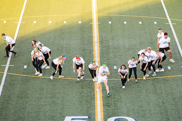 Students gather at the stadium to watch the football championship.