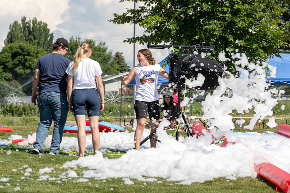 Students gather by the upper fields on the BYU-Idaho Campus to play recreation games, slip 'n' slide, mud volleyball, and try the ropes course.