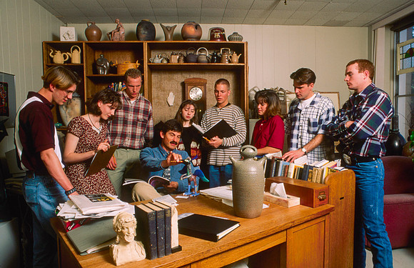 Art teacher, Matt Geddes, surrounded by his art students.