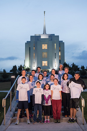 Team members pose by the Rexburg temple before they begin the temple to temple run
