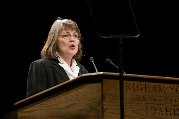 Sister Sue Clark speaking at a devotional.