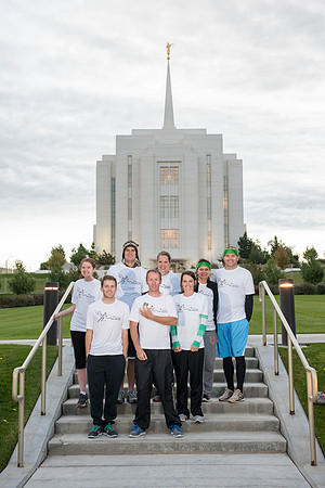 Team members pose by the Rexburg temple before they begin the temple to temple run