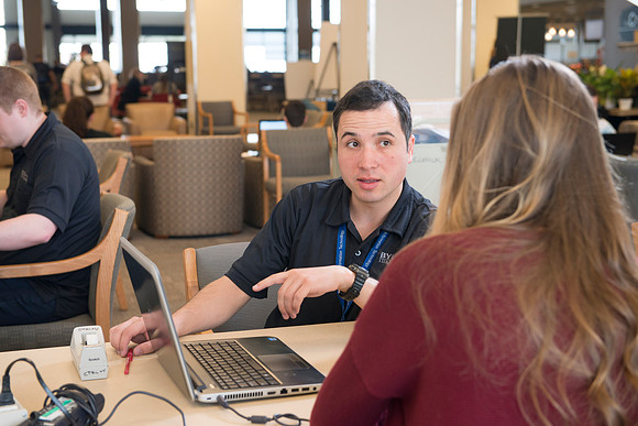 Taylor Nelson is helped by Marius Corca, a student employee from the IT Department.