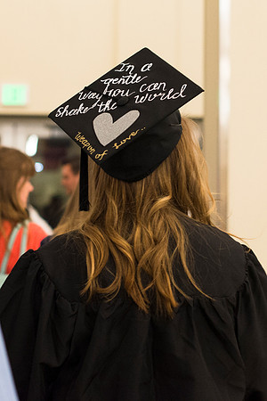 Graduate wears a message on her cap at graduation.