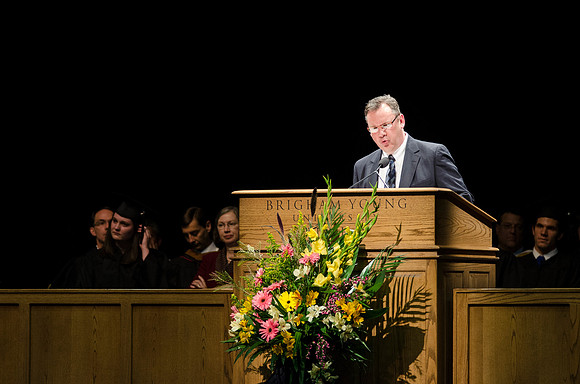 Rob Ahrendsen welcomes graduates into the BYU-Idaho Alumni Association during Convocation in the Hart Auditorium.