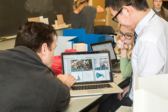 Graphic Design Class taught by Shawn Randall. Students work in teams designing museum space for the Geotourism Museum in Driggs, Idaho. The winning group will help implement their design.
