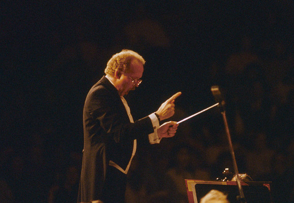 Conductor leads choir and orchestra in Visions of Eternity.