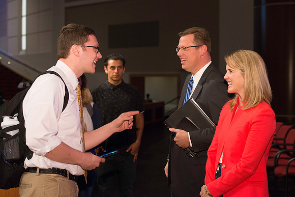 President and Sister Gilbert greet students after the first devotional of the semester.