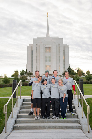 Team members pose by the Rexburg temple before they begin the temple to temple run