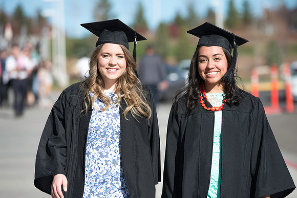 Students gather in their cap and gowns for graduation from BYU-Idaho April 6, 2016.