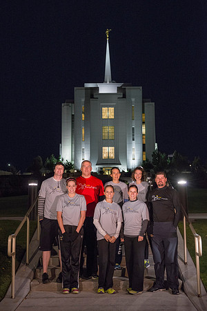Team members pose by the Rexburg temple before they begin the temple to temple run