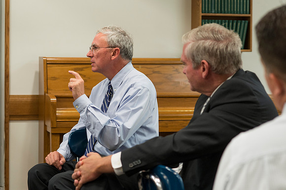 Faculty gather in the Hinckley Building at a Faculty Conference to share and learn from each other at the beginning of the 2013 Fall semester.