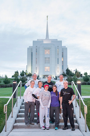 Team members pose by the Rexburg temple before they begin the temple to temple run