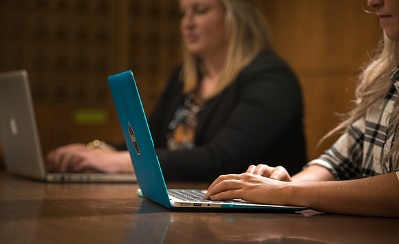 Katelyn Crompton and Rachael Redford study in the basement of the Smith Building.