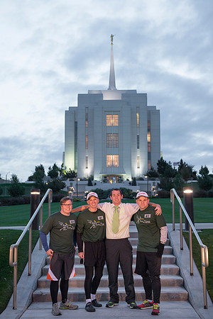 Team members pose by the Rexburg temple before they begin the temple to temple run