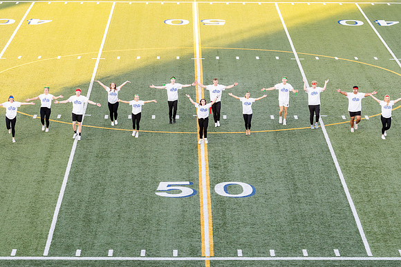 Students gather at the stadium to watch the football championship.