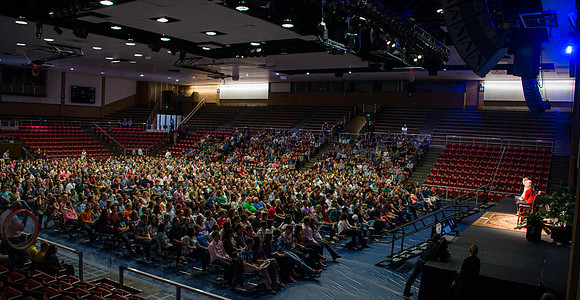 Students gather in the Hart auditorium for a date night with the Gilbert's.