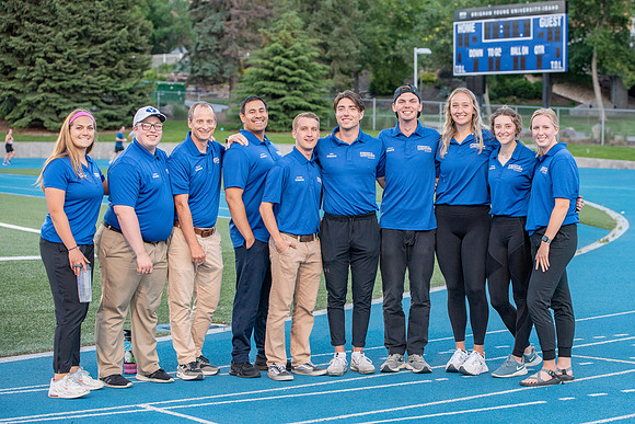 Faculty and community members of BYUI at Speed and Agility triathlete trannings at the stadium.