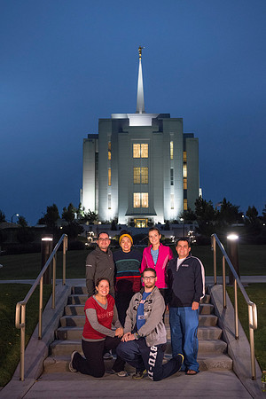 Team members pose by the Rexburg temple before they begin the temple to temple run