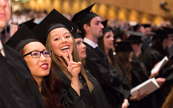Graduate Tori Butler Orme celebrates during commencement.