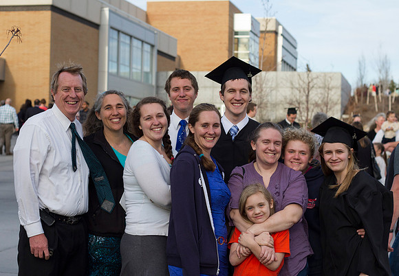 A family celebrates with a BYU-Idaho graduate after the 2014 Winter Semester Commencement. Photo by Tyler Rickenbach
