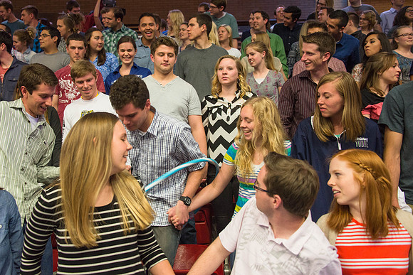 Students gather in the Hart auditorium for a date night with the Gilbert's.
