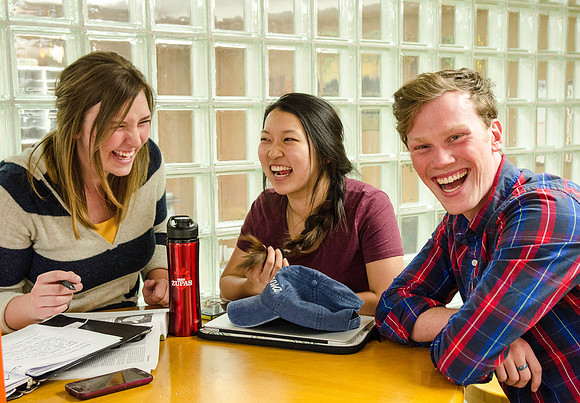 Students studying in the basement of the Benson Building.