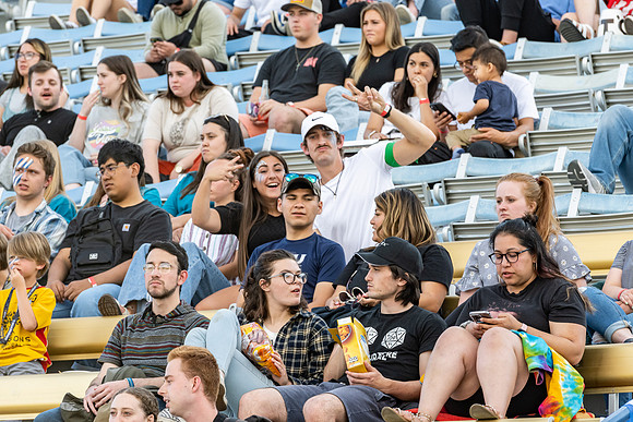 Students gather at the stadium to watch the football championship.