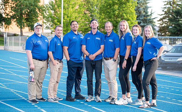 Faculty and community members of BYUI at Speed and Agility triathlete trannings at the stadium.