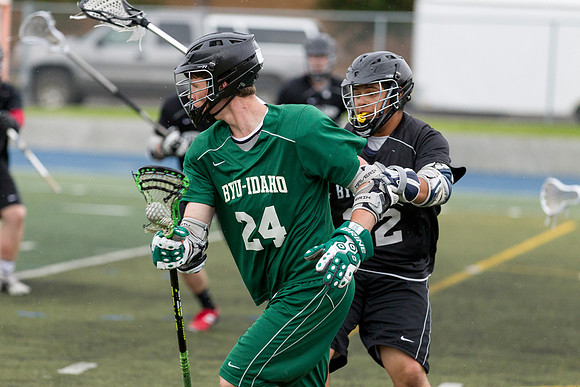 Spartan's Kevin Bosley swim dodges past a Knight defender.
