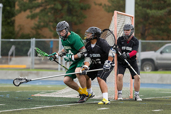 Spartan's Kevin Bosley (24) tests Knight's defender Daniel Calvillo, during Saturday's stormy game at the stadium.