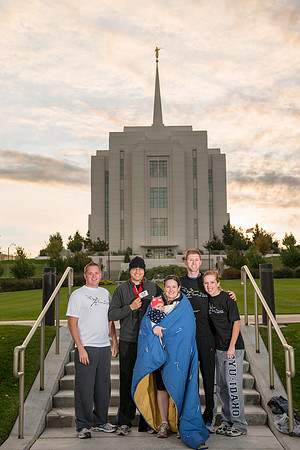 Team members pose by the Rexburg temple before they begin the temple to temple run