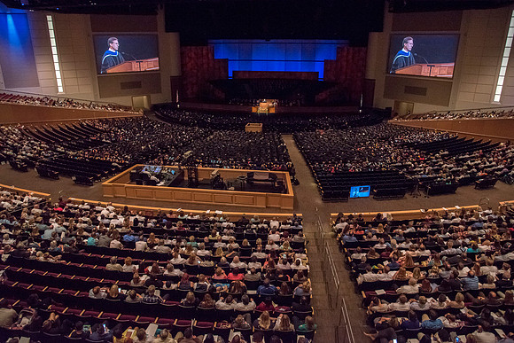 Mark B. Woodruff, Assistant to the Commissioner and Secretary to the Church Board of Education and Board of Trustees, addresses graduates at commencement. Photo by Ryan Chase