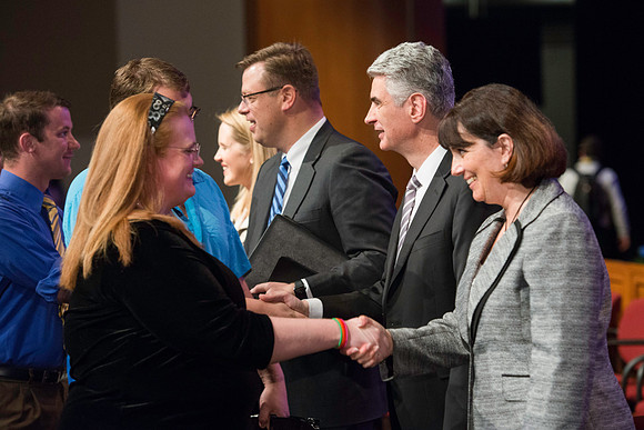 Bishop Gérald Caussé and his wife greet students after devotional.