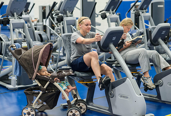 Patiently waiting while mom gets her workout in the Fitness Center which is located in the old field house portion of the Hart Buiding.