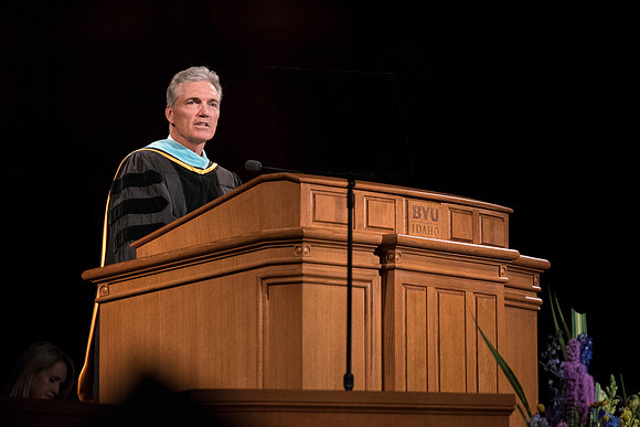 Gevin G. Durrant, First Counselor in the Sunday School General Presidency, addresses graduates at commencement. Photo by Ryan Chase