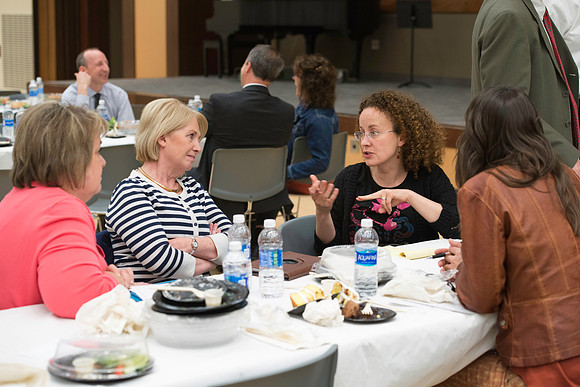 Faculty mingle after Dr. Maryellen Weimer addresses the faculty during a luncheon.