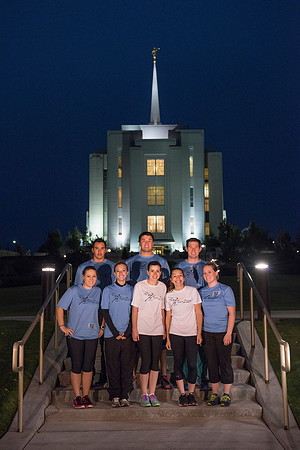 Team members pose by the Rexburg temple before they begin the temple to temple run