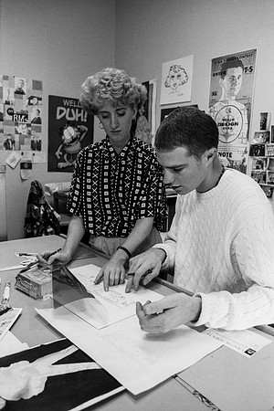 Graphic Design students, Dawn Franson and Gheen Hillman, work on a project together.